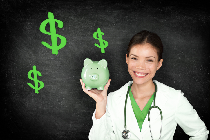 RN holding a piggy bank