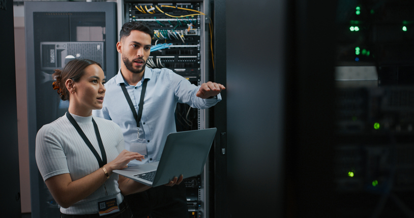Two people working to solve a networking problem.