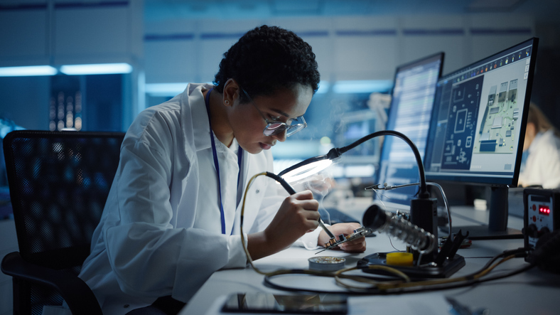 Electrical engineer testing equipment.