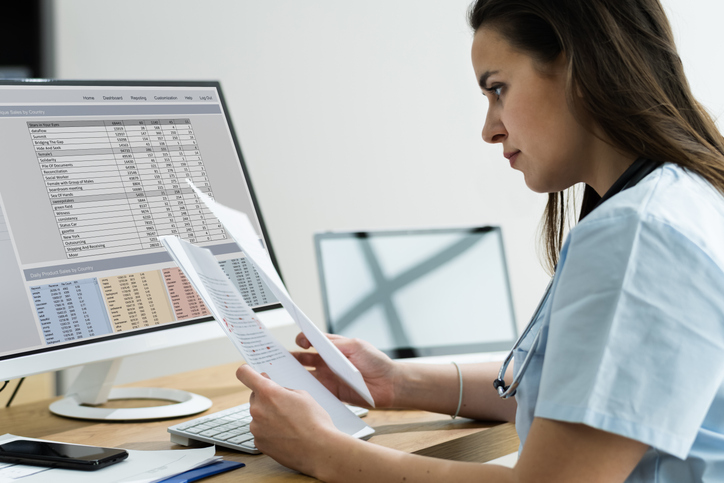 Medical Biller and Coder reviewing work.
