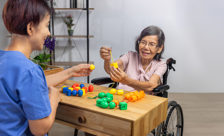 Occupational therapist helping senior