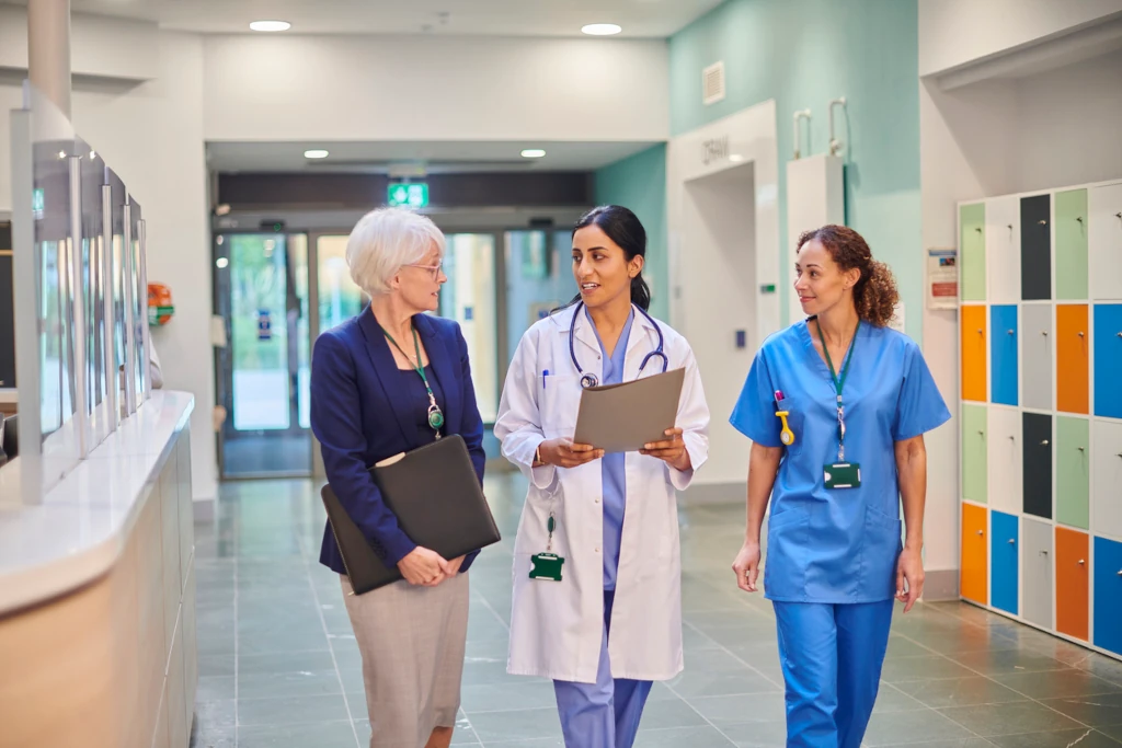 healthcare administrator with doctor and nurses