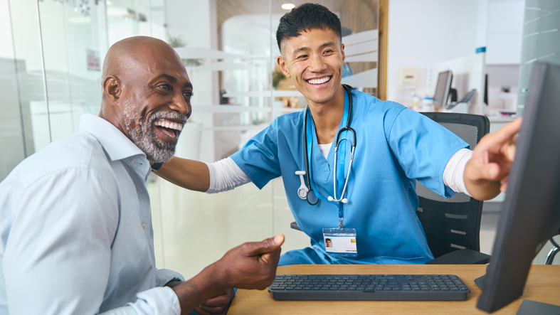 male medical assistant helping pateint
